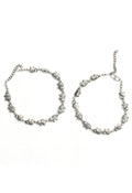 Detailed view of oxidised silver anklets with elephant design motifs
