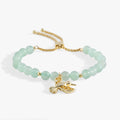 Hummingbird bolo bracelet featuring green aventurine beads and a crystal-encrusted hummingbird charm in a gold-tone finish.
