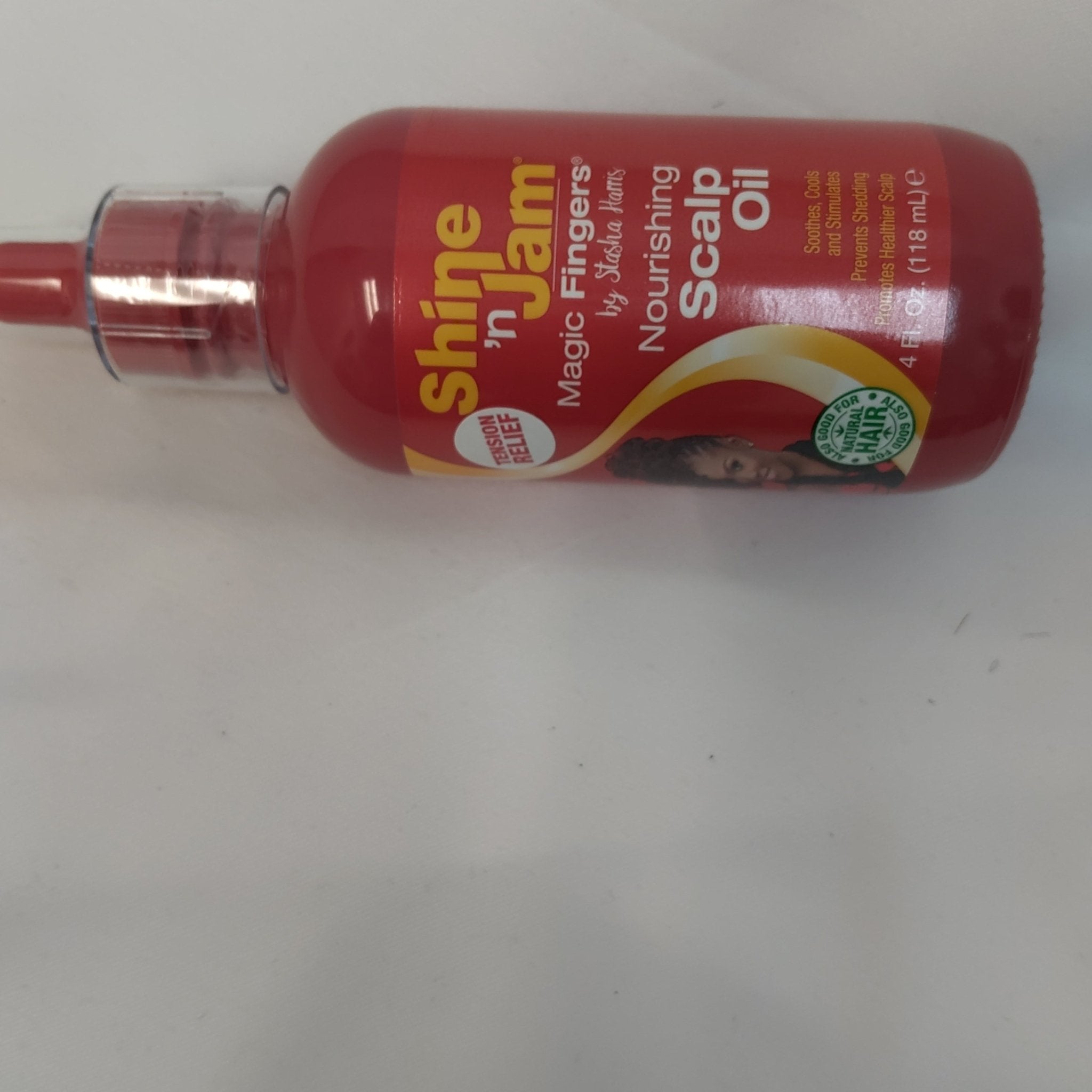 4 oz bottle of Shine-N-Jam Magic Fingers Scalp Oil