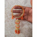 Orange silk thread bangles with gold-tone accents and hanging latkan charms