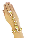 Close up of a gold and crème Kundan pearl chain Hathphool hand ornament