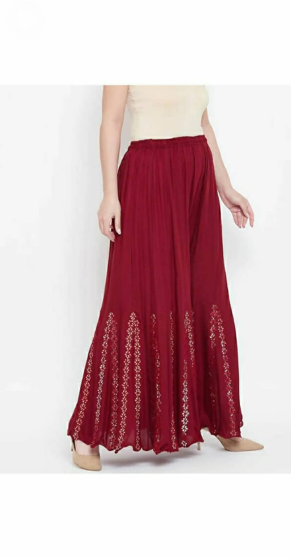A pair of maroon palazzo pants with intricate mirror floral embroidery and a wide-leg silhouette.