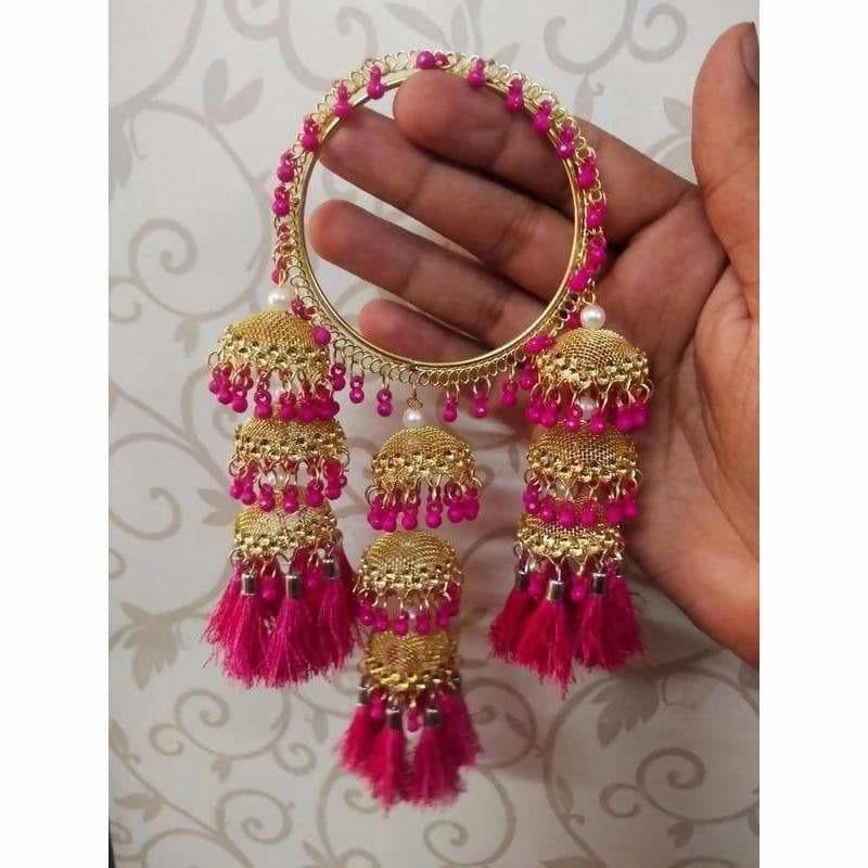 Elegant bangles with pink pearls and hanging thread jhumkas