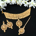 Gold-polished brass choker with Kundan and stone embellishments