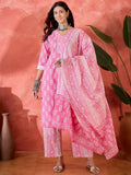 A woman wearing a stylish pink printed pure cotton kurta set with a traditional aesthetic.