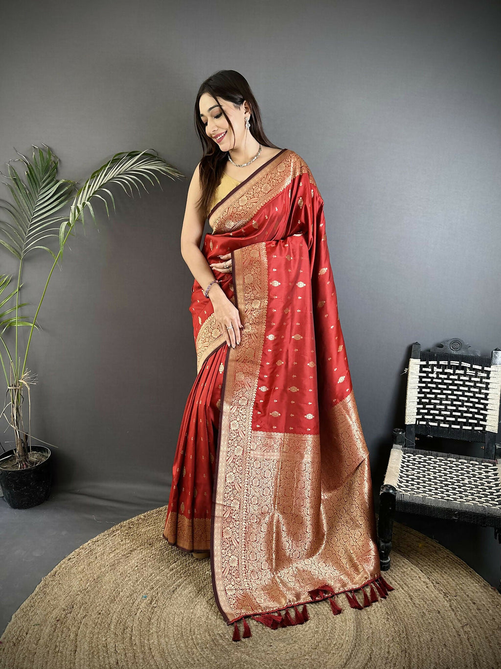 Red Lichi Silk Banarasi saree with intricate gold zari weaving motifs and matching blouse