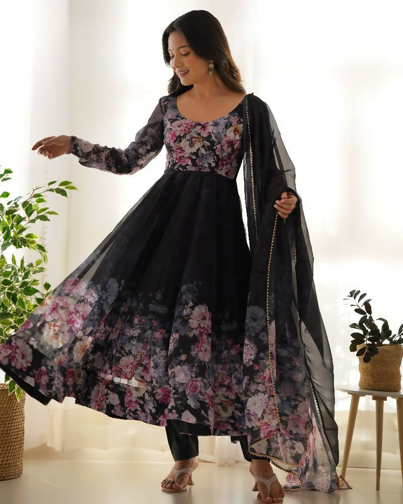 Elegant black 3-piece kurta set in organza fabric featuring detailed sequin embroidery.