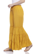 Mustard yellow wide-leg palazzo pants made from rayon cotton fabric.