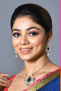 Golden pendant set with white American diamonds and matching earrings