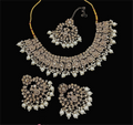 Cream stone work necklace set with matching earrings for elegant styling