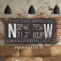 Personalized family name wall art featuring latitude and longitude coordinates on canvas