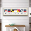 Nautical welcome sign featuring maritime signal flags on a vintage map background for coastal home wall decor