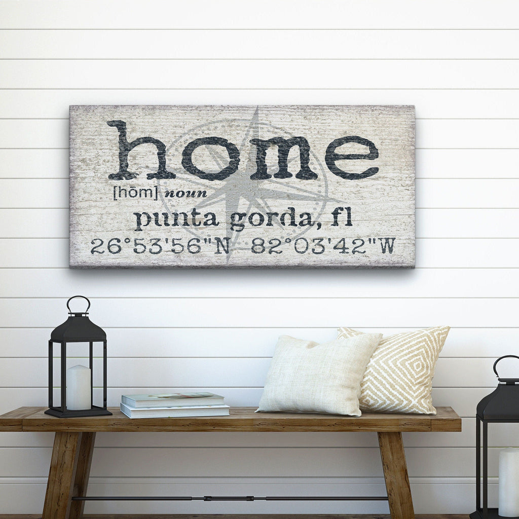 Customizable compass coordinates wall art on canvas with farmhouse and rustic aesthetic.