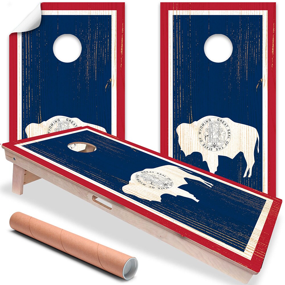 Set of two Wyoming state flag cornhole board vinyl wraps featuring a white bison silhouette on a blue background