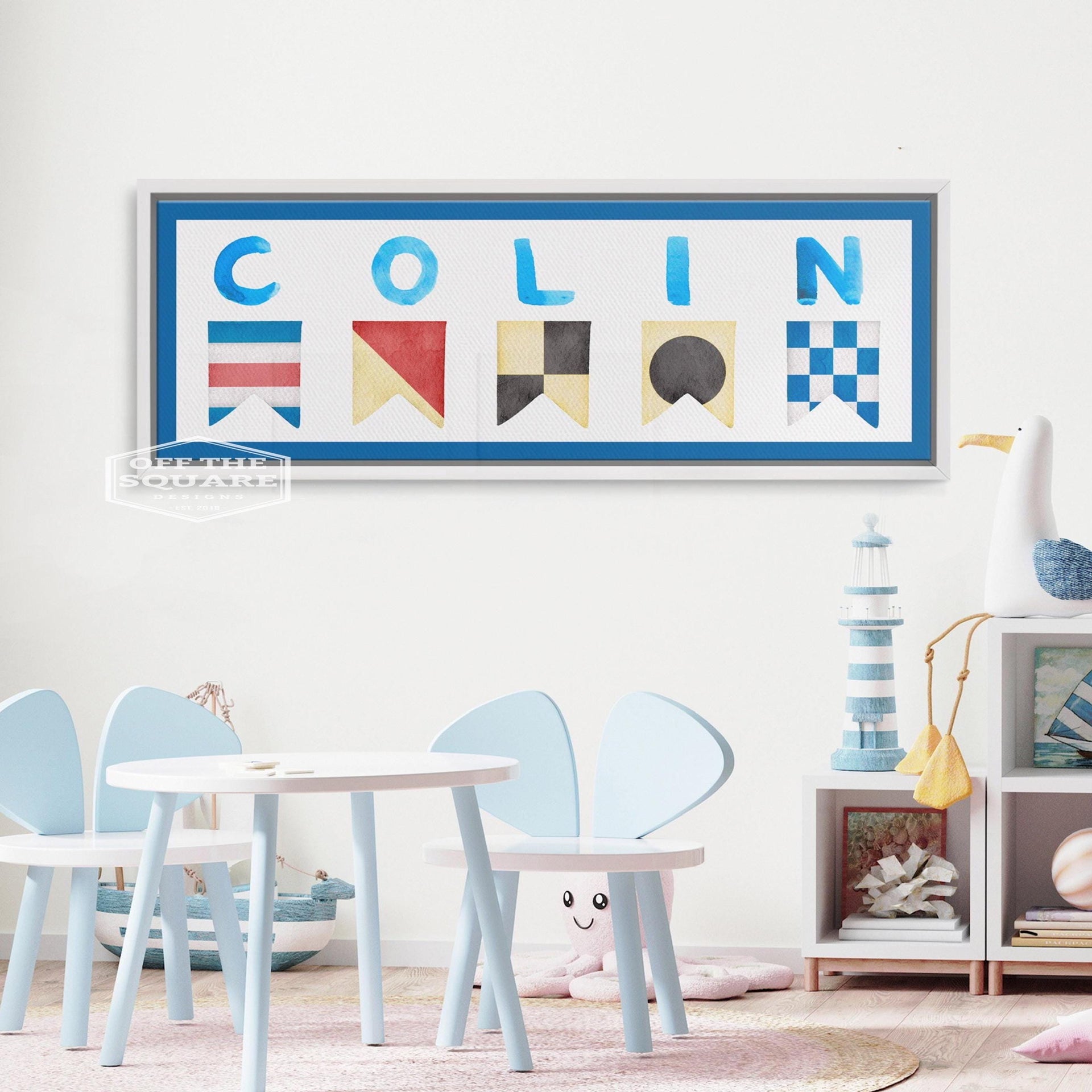 Personalized nautical flag wall art featuring a child's name in a framed canvas print.