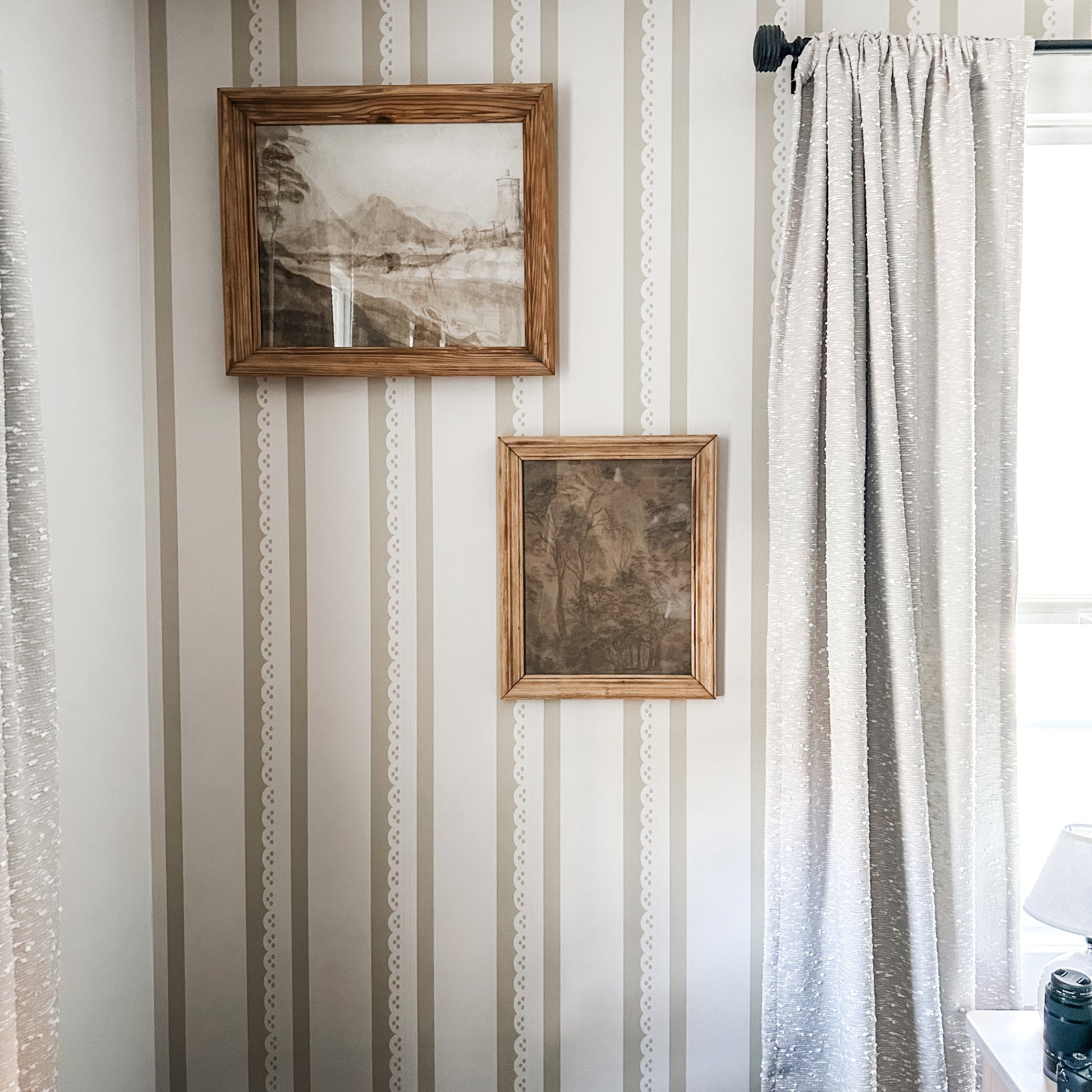 Dorit Wallpaper by Cinnamon Clouds featuring a decorative, removable pattern on a modern living room wall.