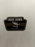 Nose Down branded high-contrast graphic decal in black, white, and red for outdoor gear