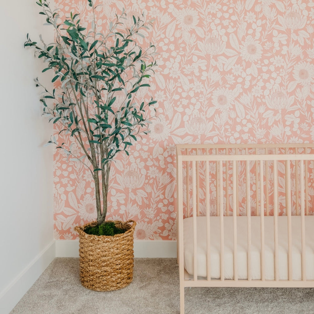 Polly floral wallpaper featuring delicate peach and cream colors.