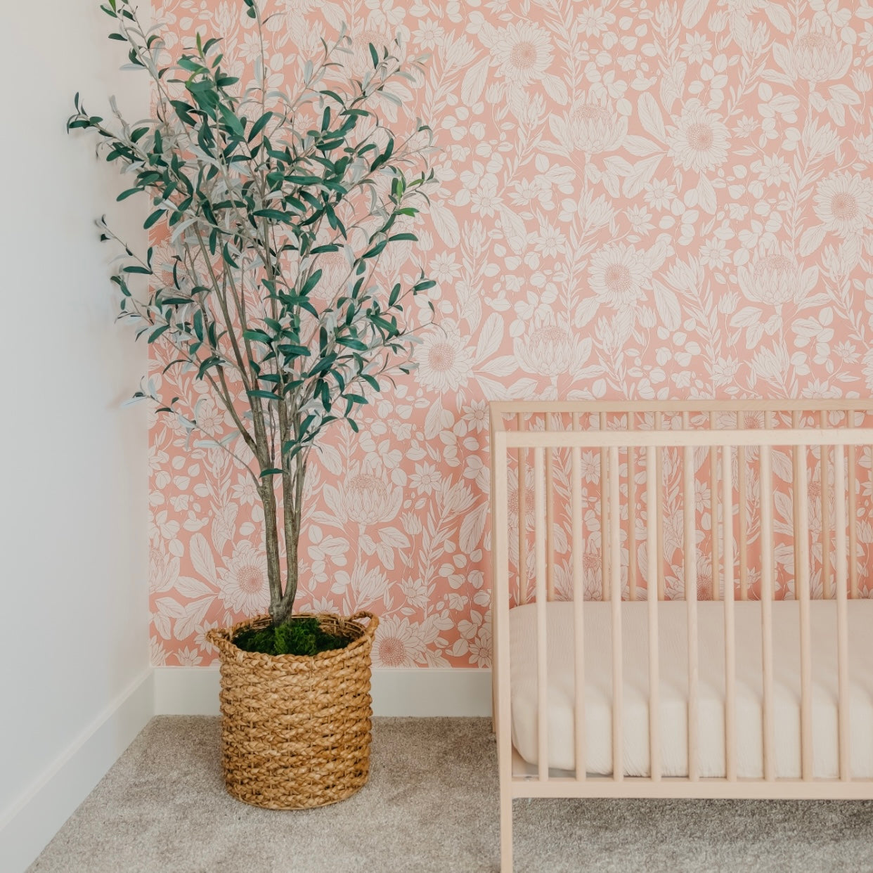 Polly floral wallpaper featuring delicate peach and cream colors.
