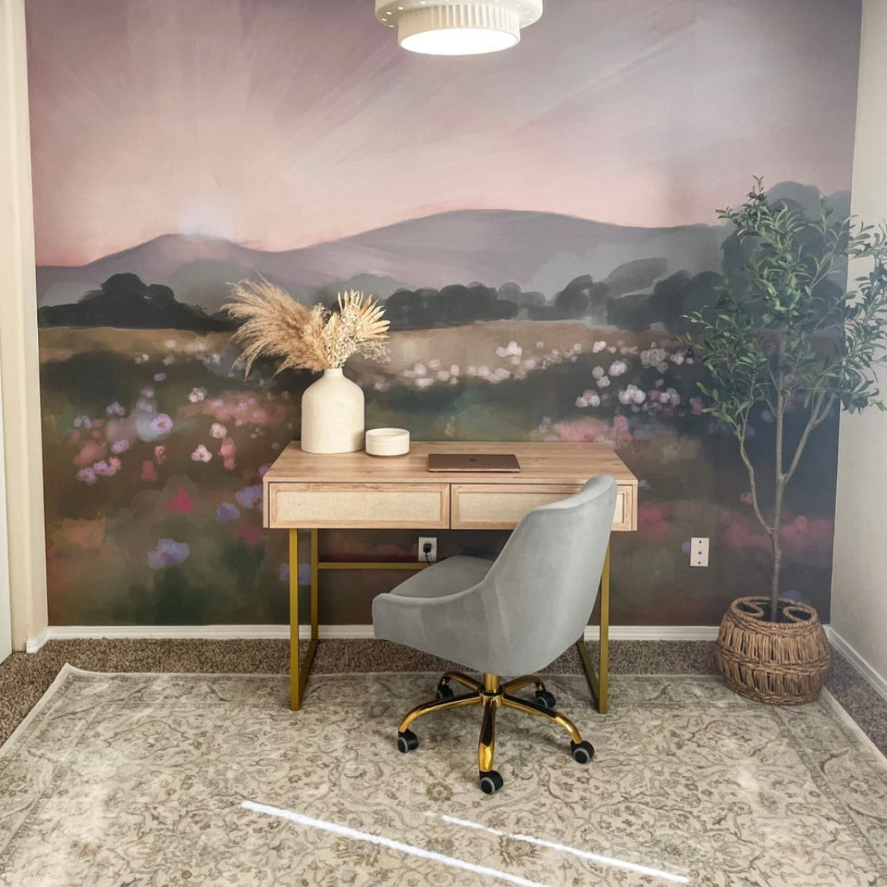 Eden floral print wallpaper by Mariah Rose installed on a living room accent wall.