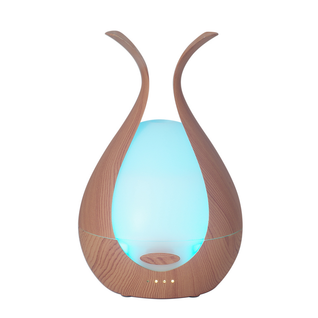 A decorative wood grain ultrasonic essential oil diffuser with glowing blue LED light inside a teardrop shape.