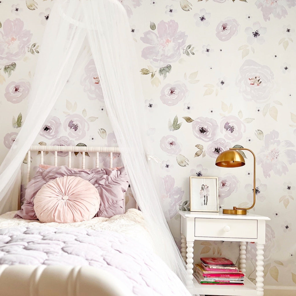 Whimsical Leah floral wallpaper in lavender and white, ideal for a nursery-chic room.