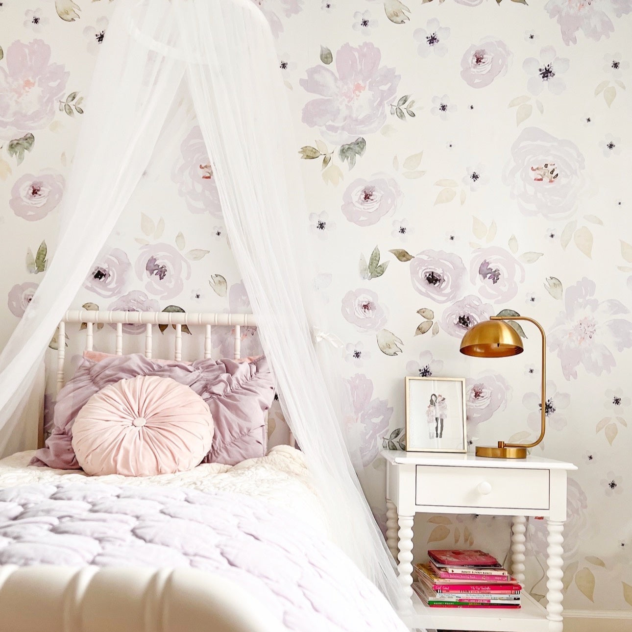 Whimsical Leah floral wallpaper in lavender and white, ideal for a nursery-chic room.
