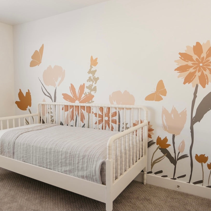Amelia floral wallpaper in terracotta, pink, and sage-green for a bohemian-inspired room.