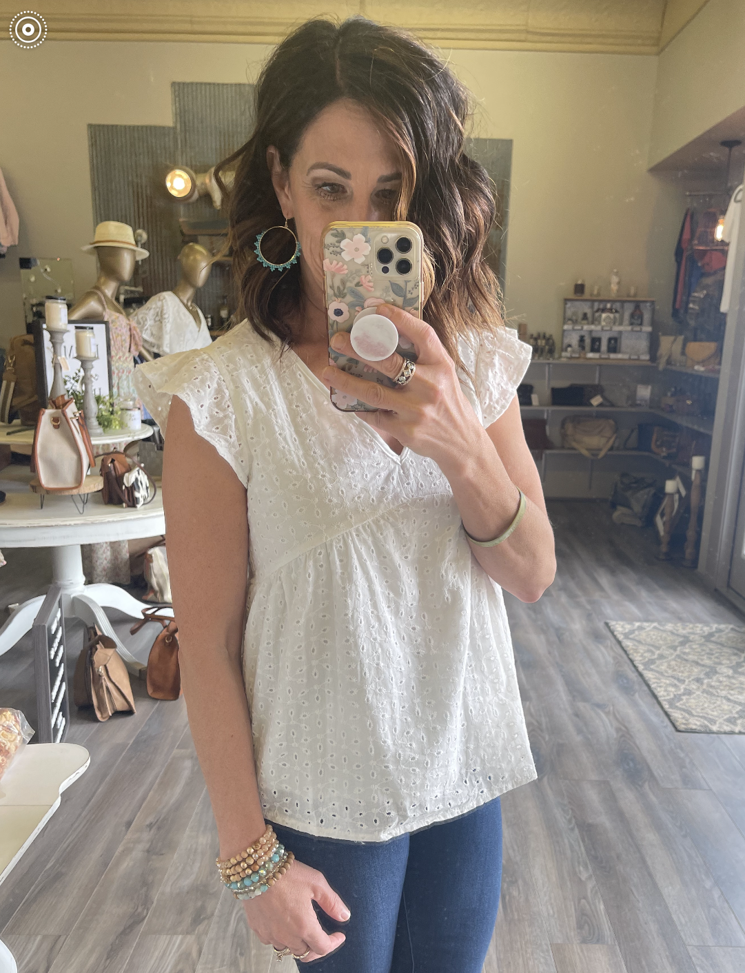 White V neck sleeveless loose top for women, featuring a comfortable relaxed fit