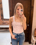 Close up of ribbed square neck tank top with ruffled straps