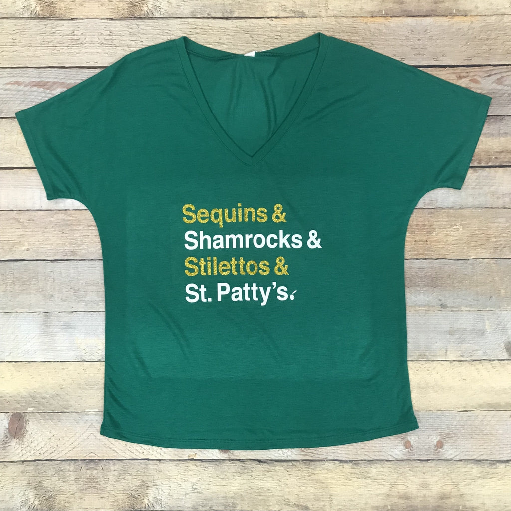 Shamrocks & Stilettos holiday themed knit top in green, gold, and white