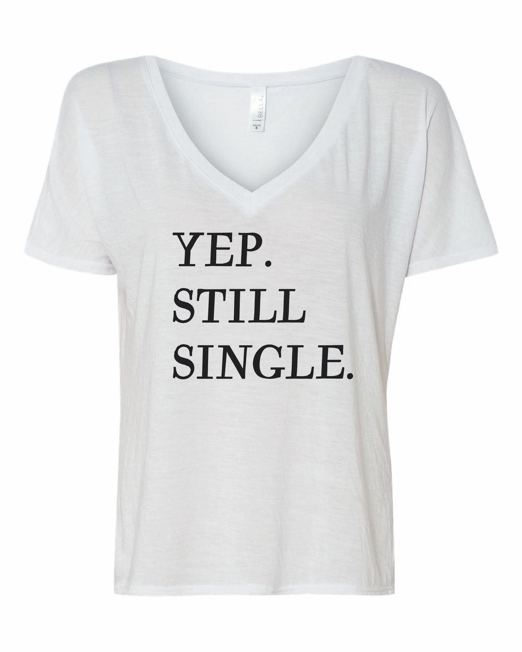 Close up of a casual graphic t-shirt with the text Yup, Still Single