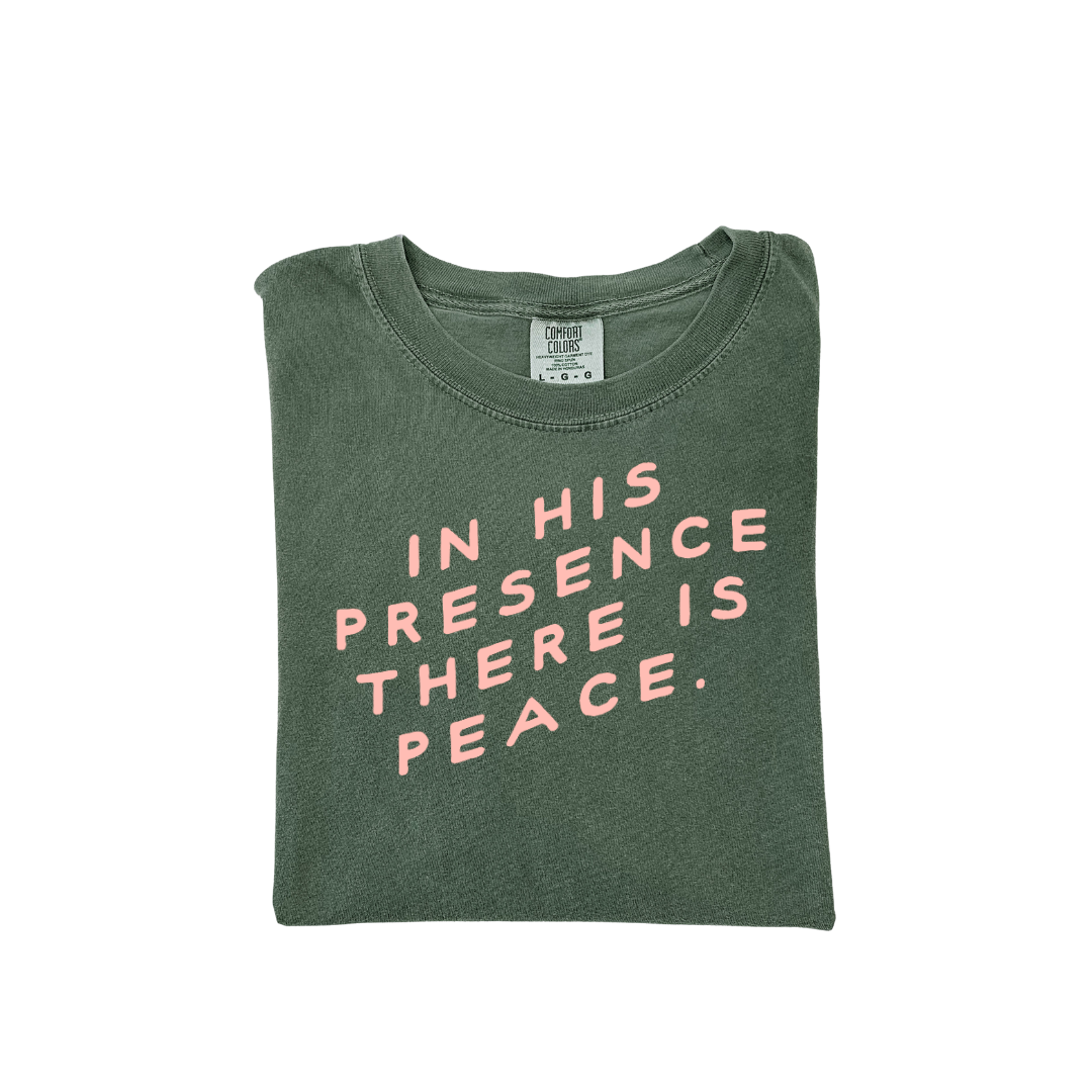 Unisex graphic t-shirt featuring the text In His Presence There Is Peace.