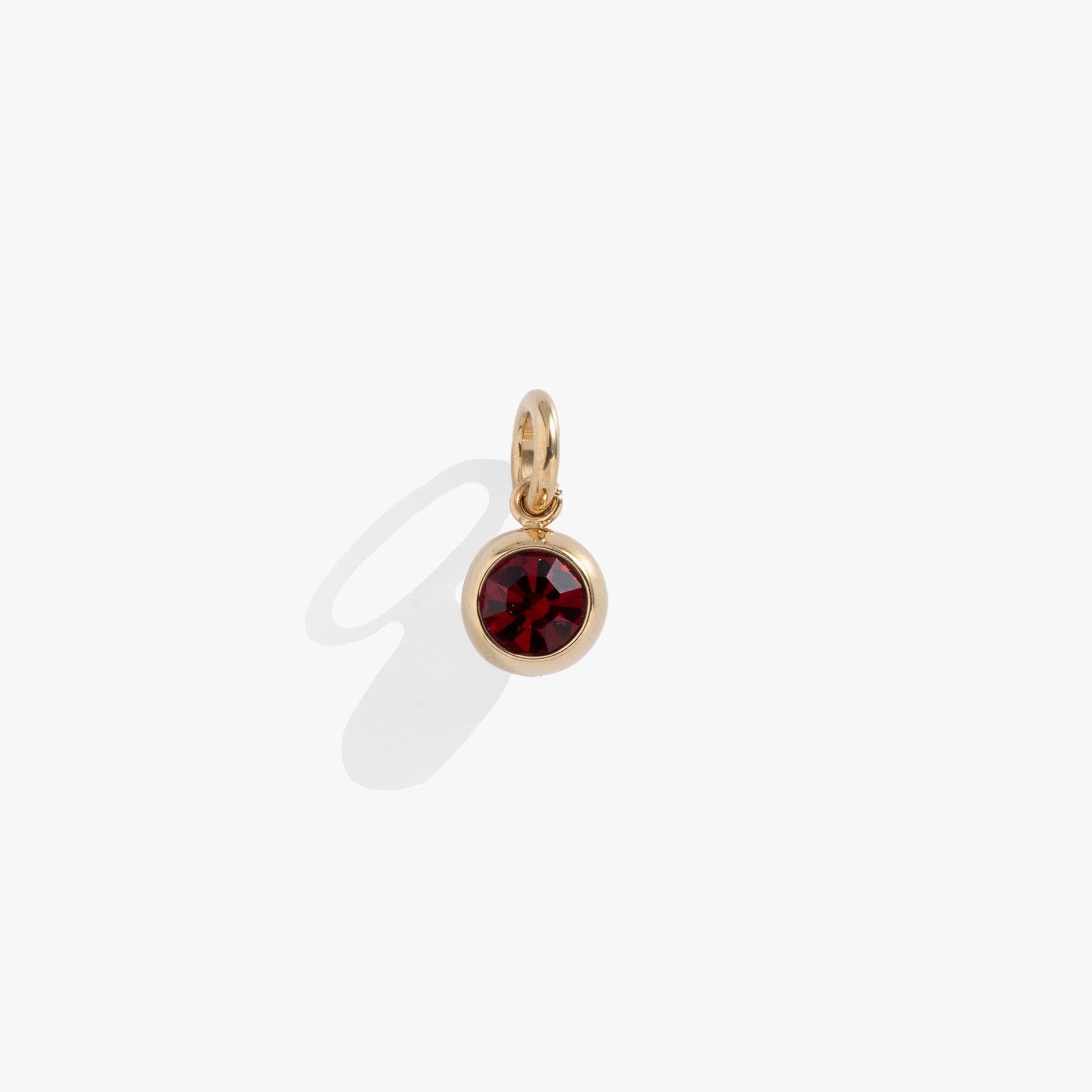 January birthstone charm featuring a garnet-colored crystal for necklaces and bracelets.