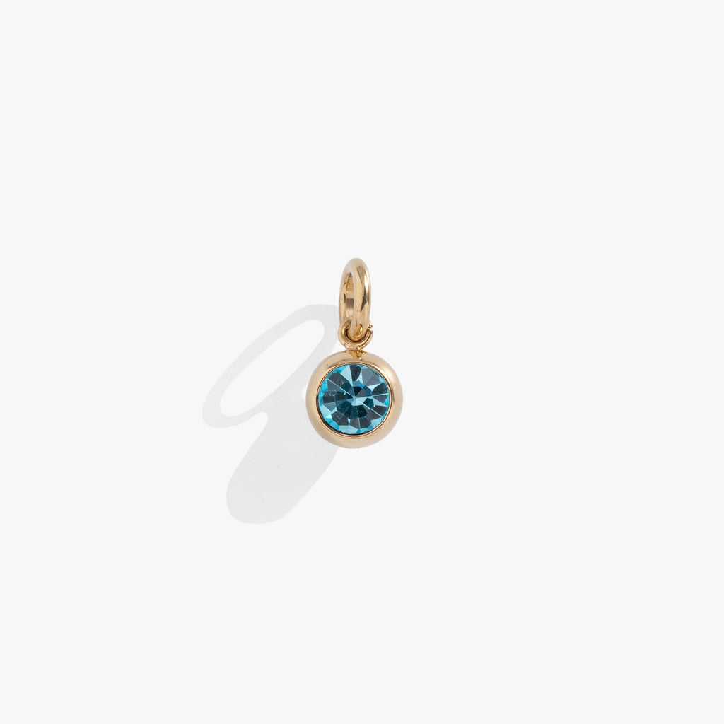 Round aquamarine crystal charm with polished gold bezel setting, perfect for charm bracelets or necklaces.