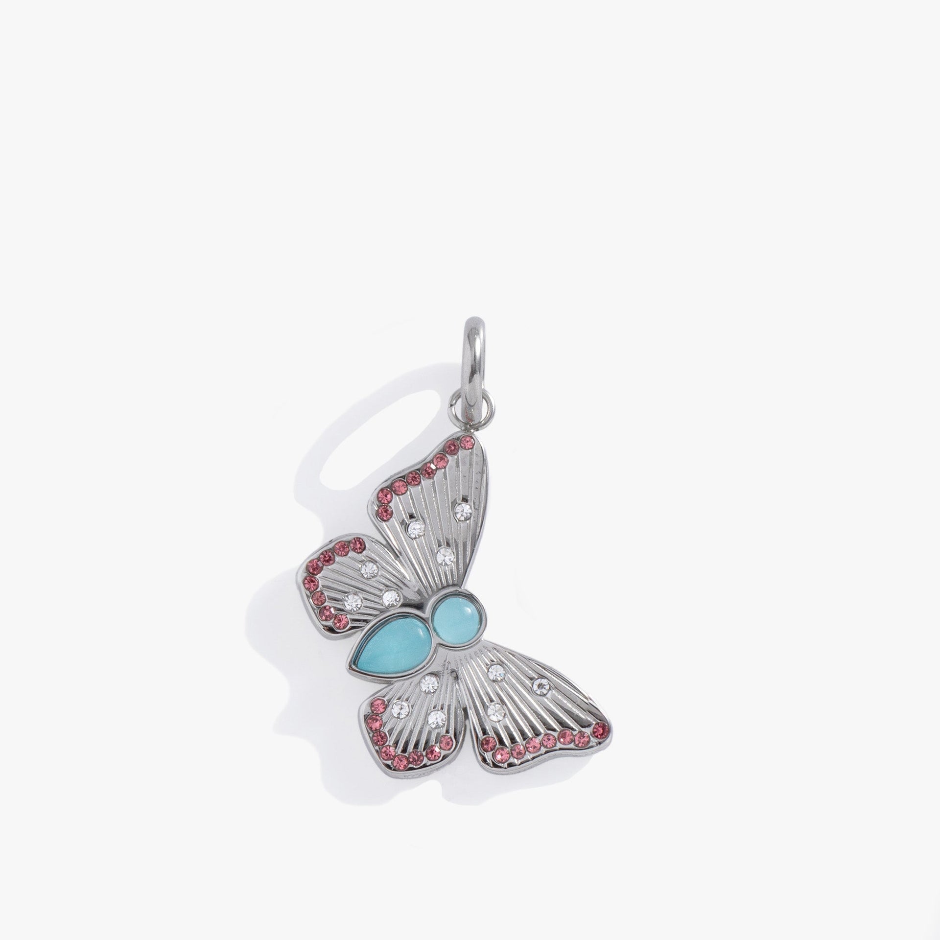 Silver-tone butterfly charm with clear crystals and a dyed blue quartz body.