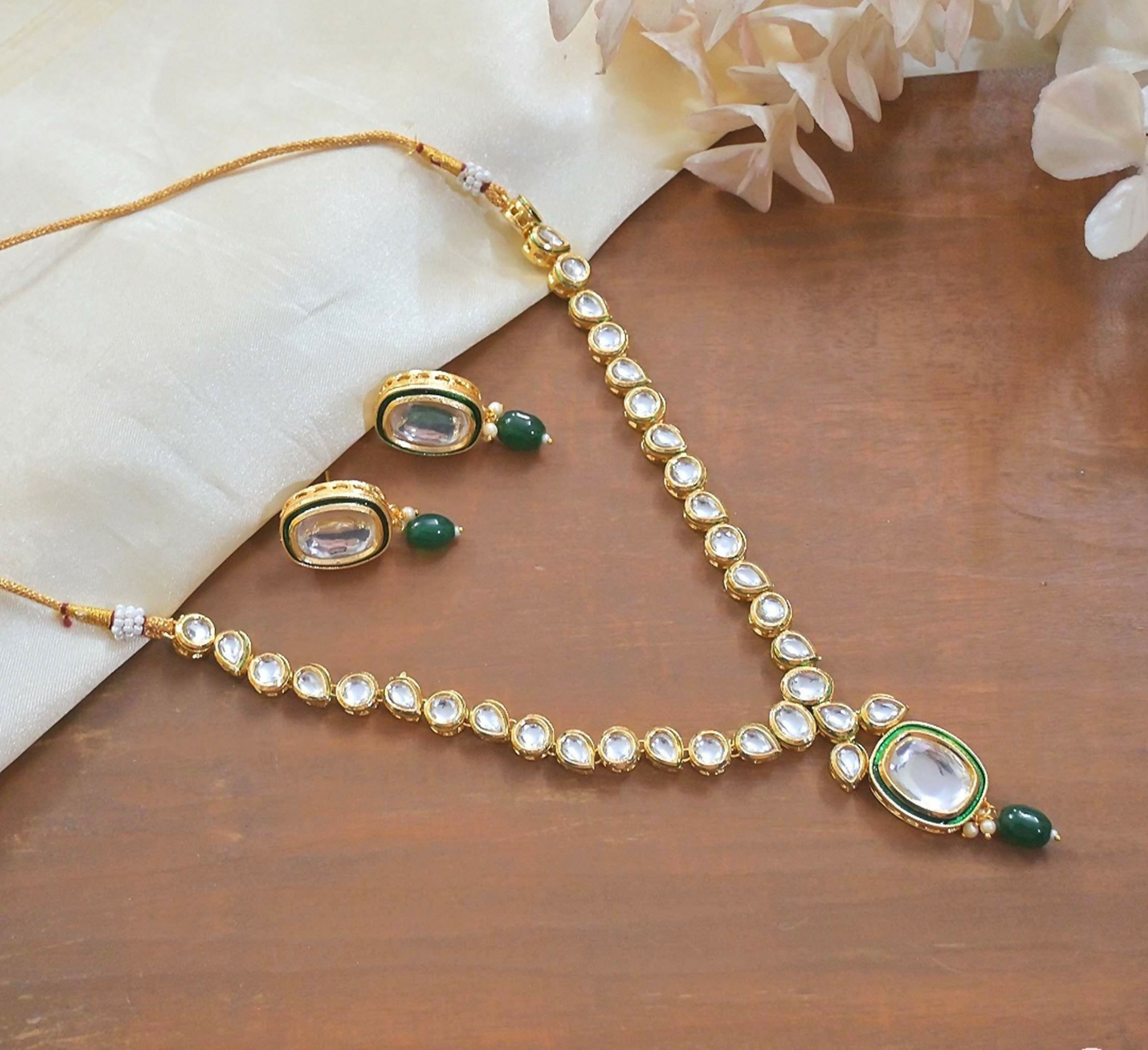 Traditional green Kundan choker necklace with gold-tone copper finish for ethnic wear