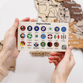 Vibrant, small circular Italy regional flag pins featuring red, white, green, and gold colors on a travel map.