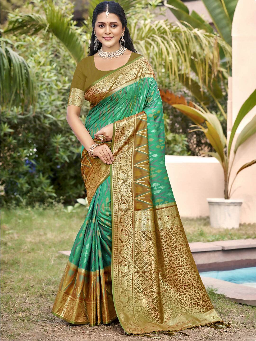 Rama Green Pochampally Silk Saree with matching blouse piece featuring traditional weave.