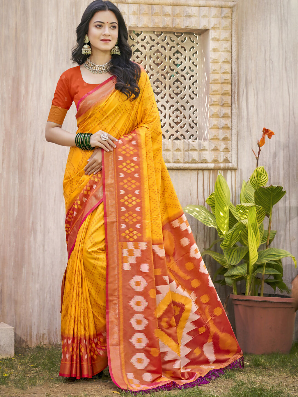 Yellow Pochampalli Silk saree with a vibrant contrast pink blouse