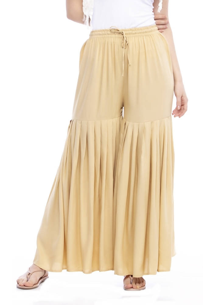 Girls golden rayon cotton wide-leg palazzo pants with bohemian ethnic design.