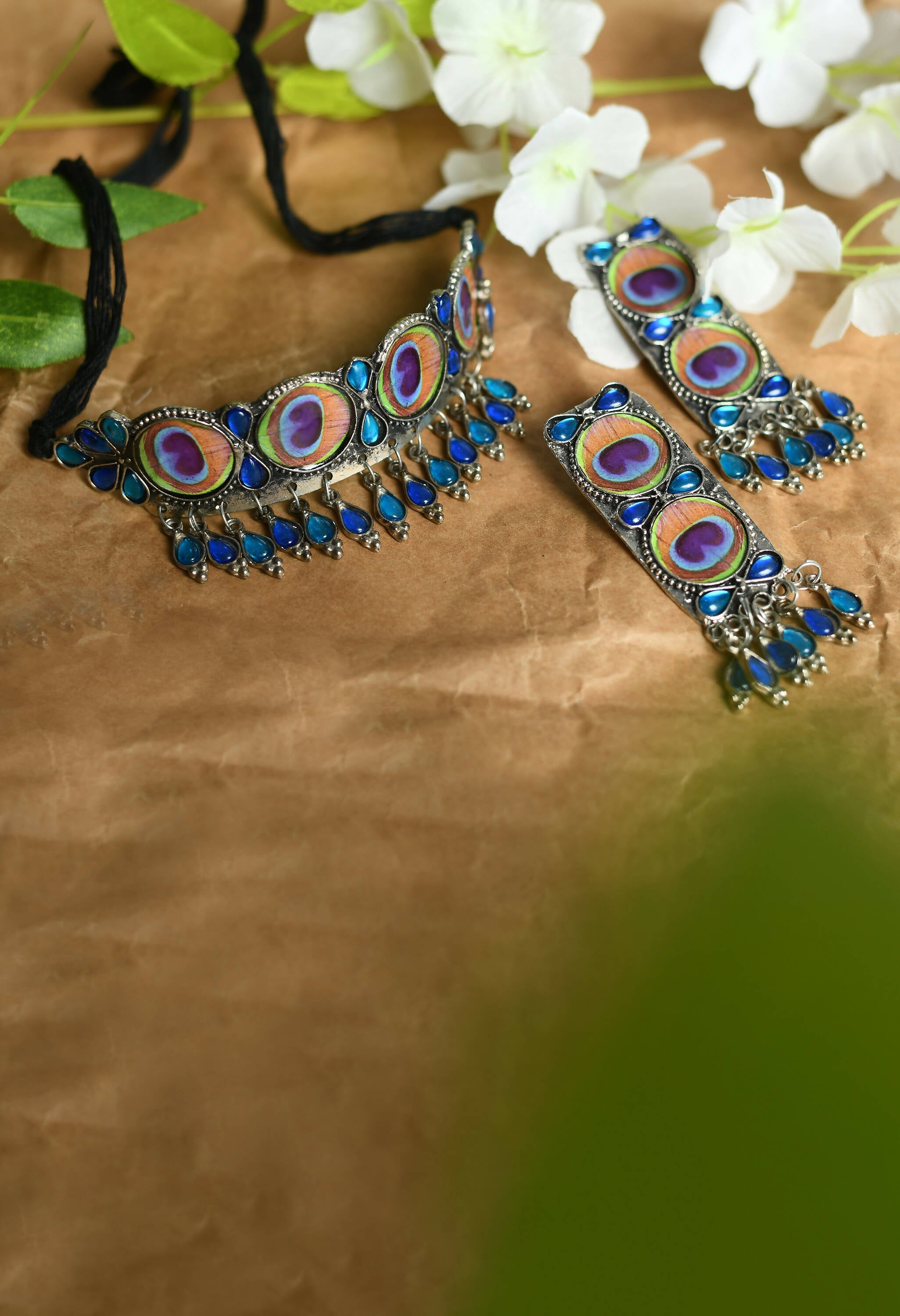 Oxidised silver-plated brass choker featuring a detailed peacock wings design