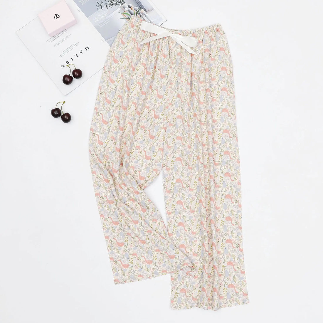 Women's loose casual pajama pants with printed designs and an adjustable waist ribbon.