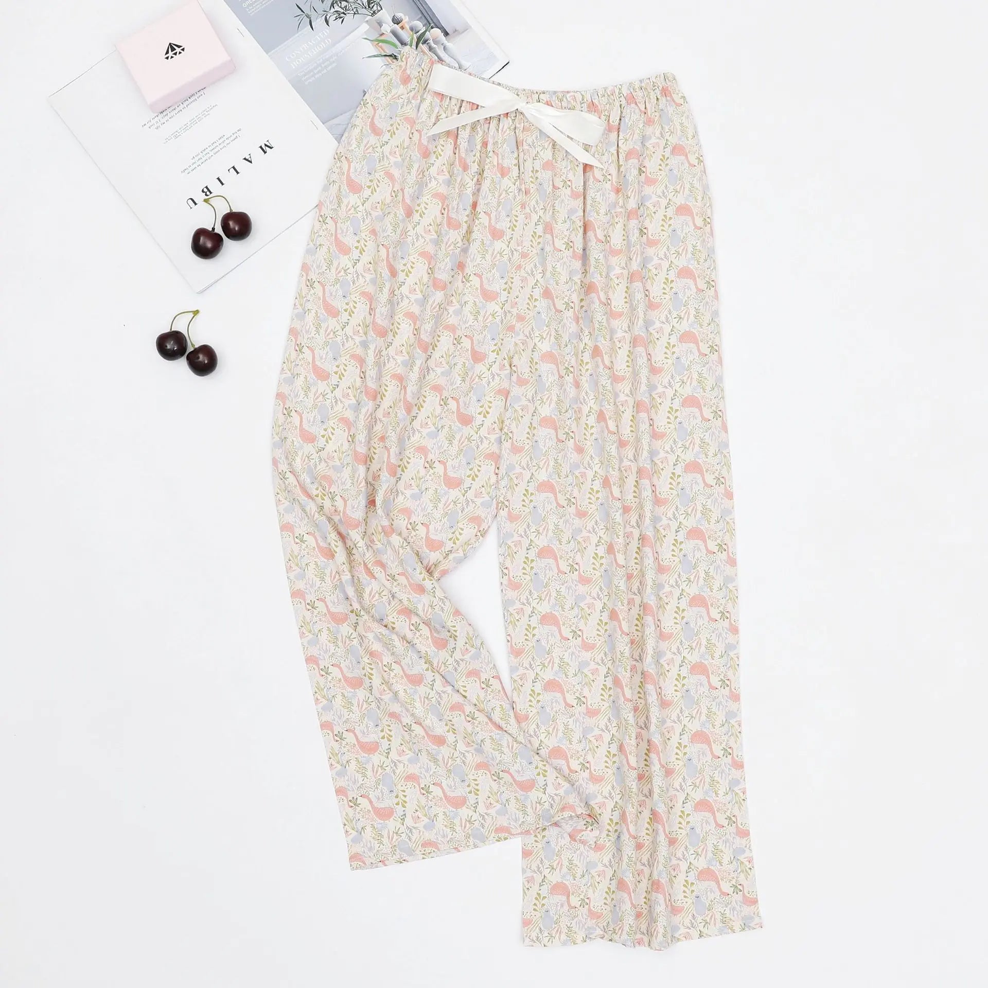 Women's loose casual pajama pants with printed designs and an adjustable waist ribbon.