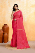 A beautiful Rani Pink handloom cotton blend saree with zari check pattern and embellishments.