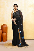 Black cotton blend saree adorned with intricate embroidery and elegant embellishments