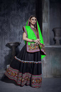 Black art silk lehenga choli with green dupatta and multi-colored blouse