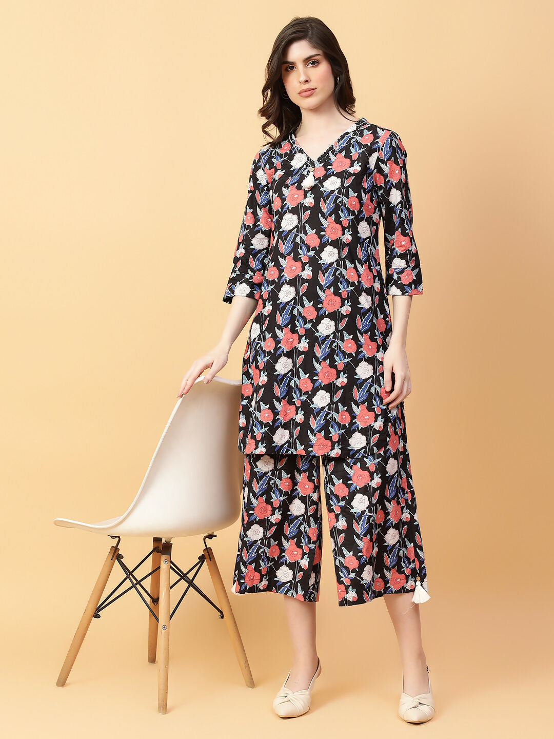 A stylish black cotton printed co-ord set featuring hand-work details.