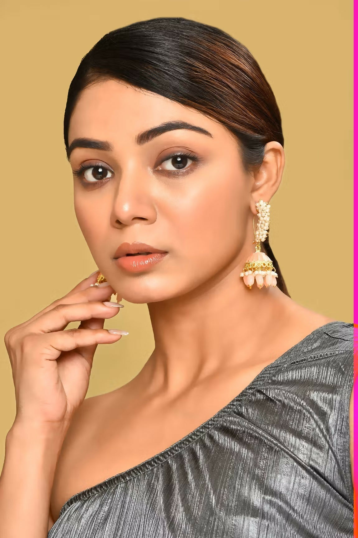 Elegant golden peach Kundan pearl earrings for women, featuring intricate craftsmanship