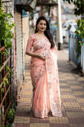 Pink pure linen saree with pencil stitch embroidery and matching embroidered blouse